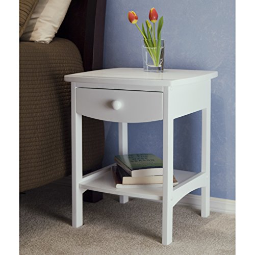 Winsome Wood Claire Accent Table, White Traditional, clean-lined finish desk/night time stand affords informal fashion
Crafted of stable beechwood; wooden nailhead accents
Easy carved rails complement roomy storage drawer and open shelf
Some meeting required; measures 18-inch in diameter by 22-inch excessive
Out there in Pure, Walnut, Black, or White Combining stable/composite wooden development with a tidy and sensible fashion, this versatile finish desk/night time stand makes a contemporary and clear addition to the room. The outsized tabletop contains a straight-edged sq. form, whereas under the 4 rectangular legs host a deep storage drawer and open shelf. For refined aptitude, the drawer entrance and decrease facet rails are sculpted with a large curve that softens the desk's total look. Additionally discover how the wooden nailhead accents and a easy drawer pull provide a tailor-made end. Traditional sufficient to remain in fashion irrespective of how the furnishings round it change, this desk is available in 4 good-looking finishes: Pure, Walnut, Black, and White. It measures 18 inches in diameter by 22 inches excessive. --Kara Karll