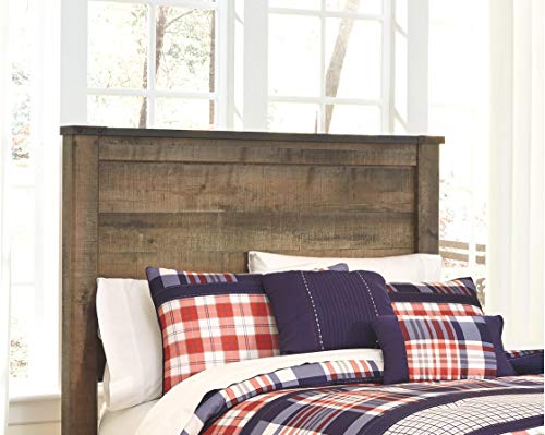 Full Panel Headboard by Ashley Furniture: Rustic Charm for Full-Size Beds - Brown Finish The rustic panel design, crafted from replicated veneer and artifical wood, adds a homey touch to any space. The genuine-looking grain and nailhead accents tie together rustic elements and inspiration from reclaimed barn wood, resulting in a refreshingly simple yet refined design. The headboard not only meets design necessities but also provides a charming, stylish finish for both vintage and contemporary bedrooms. With easy assembly instructions and compatibility with existing bed frames, the Trinell Headboard is a delightful addition to any bedroom seeking a touch of rustic elegance. Trinell Full Panel Headboard is designed to meet all your style requirements and add a touch of rustic charm to your bedroom. The versatile design complements various bedroom themes, from vintage to contemporary, making it suitable for different decor preferences.