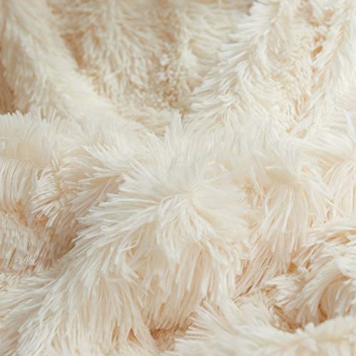 Comfort with Plush Shaggy Luxurious Fake Fur Blanket in Gentle Beige – Queen Size Cozy Bliss Wrap yourself in unparalleled comfort and style with our Plush Shaggy Luxurious Fake Fur Blanket in the inviting shade of Gentle Beige. This queen-sized blanket is the epitome of warmth and coziness, making it perfect for enhancing your relaxation time. Whether you're cuddling up on the sofa, adding an extra layer to your bed, or simply enjoying a quiet moment, this luxurious blanket is your ticket to pure relaxation. 🛌 Ultimate Softness: The front of this blanket boasts 100-percent polyester microfiber plush shaggy, providing a cloud-like softness that you'll love to touch and snuggle with. ❄️ Warm and Breathable: Experience the best of both worlds. This blanket offers exceptional warmth while maintaining breathability, so you stay cozy without overheating. 🌈 Elegant Appearance: Add a touch of grace and sophistication to your room's decor with the Gentle Beige shade. It effortlessly complements various interior styles. 🌟 No Shedding: Say goodbye to those pesky fuzz balls. Our high-quality Fake Fur Throw Blanket does not shed, ensuring your sofa and bed stay spotless.  
