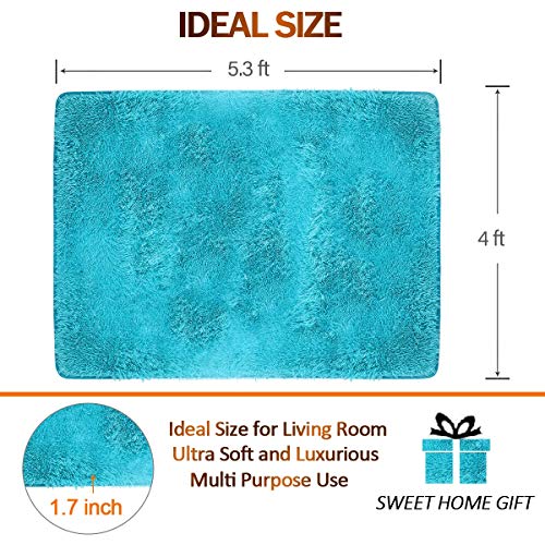 Noahas Super Soft Modern Shag Area Rugs Fluffy Living Room Noahas Tremendous Mushy Trendy Shag Space Rugs Fluffy Dwelling Room Carpet Cozy Bed room Dwelling Embellish Flooring Youngsters Taking part in Mat Four Ft by 5.three Ft, Blue.