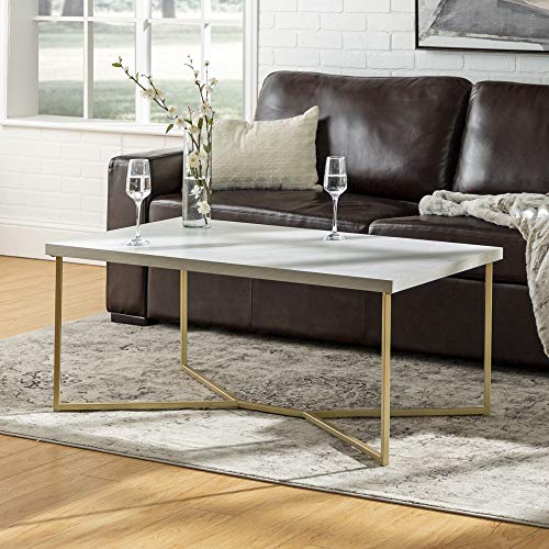 Walker Edison Marble Gold Mid Century Modern Coffee Table - Chic and Functional Centerpiece for Living Rooms! 🌟🛋️ Walker Edison Marble Gold Coffee Table, I can confidently say it's more than just a piece of furniture; it's a statement of modern elegance. The captivating Marble/Gold color combination adds a touch of sophistication to my living room. Crafted from high-grade MDF and featuring a sturdy metallic base, this coffee table is not just about aesthetics—it's a durable and long-lasting addition to any home. Its dimensions of 42 L x 24 W x 18 H inches make it a perfect fit, and pairing it with the matching side tables completes the cohesive look. With a robust capacity of supporting up to 75 pounds, it's as functional as it is stylish.