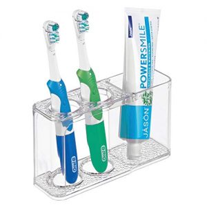 mDesign Modern Plastic Bathroom Toothbrush and Toothpaste Stand Holder - Dental Organizer with 3 Storage Compartments for Bathroom Vanity Countertops and Medicine Cabinet - Clear