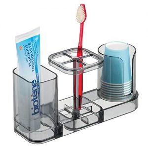 mDesign Plastic Bathroom Vanity Countertop Dental Storage Organizer Holder Stand for Electric Spin Toothbrushes/Toothpaste with Compartment for Rinse Cups - Compact Design - Smoke Gray