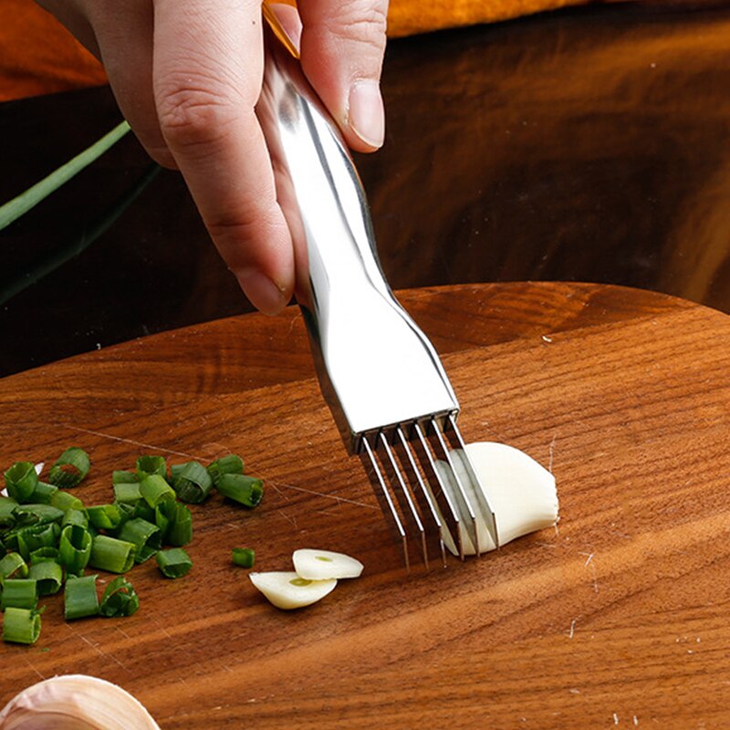 Kitchen Knife Onion Garlic Vegetable Cutter - Your Essential Cooking Companion The Kitchen Knife Onion Garlic Vegetable Cutter is a must-have in every kitchen. It's not just a knife; it's a versatile kitchen gadget that simplifies your food preparation tasks. Efficient Cutting: This cutter is designed to make your chopping, slicing, and dicing tasks quick and efficient. Whether you're tackling onions, garlic, vegetables, or other ingredients, it gets the job done with precision. Saves Time and Effort: Say goodbye to tedious chopping and slicing by hand. This kitchen gadget streamlines the process, saving you time and effort in the kitchen. Cooking Convenience: If you're a home cook or a professional chef, having the right tools at your disposal is crucial. This cutter makes cooking more enjoyable and helps you achieve consistent results in your dishes.  