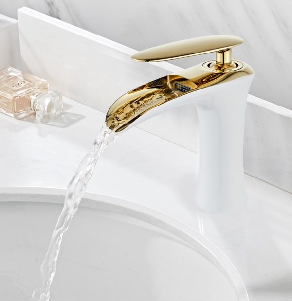Elegance Redefined: Waterfall Basin Faucet in White, Chrome, or Gold - Experience the Epitome of Style and Function Elevate the ambiance of your bathroom with the Waterfall Basin Faucet by Amibronze. This faucet is not just a fixture; it's a statement piece that combines style and functionality in one elegant package. Whether you choose the pristine white, classic chrome, or opulent gold finish, this faucet will add a touch of luxury and sophistication to your bathroom decor. Perfect for both contemporary and traditional settings, it's the ultimate choice for upgrading your bathroom. Aesthetic Brilliance: ✨ The Waterfall Basin Faucet redefines elegance with its sleek and modern design. Its gentle, cascading water flow offers a unique sensory experience, turning your basin into a work of art. Sturdy Brass Construction: 🛡️ Crafted with precision from high-quality brass, this faucet is built to last. It's corrosion-resistant, ensuring it remains beautiful and functional over time.  