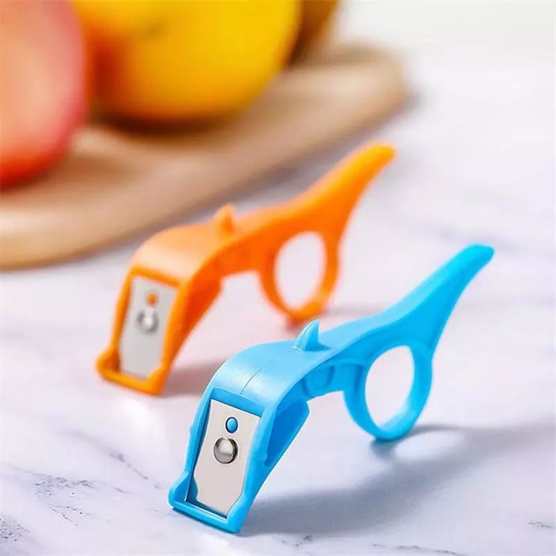 Vegetable Fruit Peeler Finger Ring Finger Ring Design: The peeler is designed with a finger ring that provides stability and control while peeling. This feature allows you to maintain a firm grip on the peeler, reducing the risk of slipping and accidents. Color Variety: You have the option to choose from multiple colors, including pink, blue, and orange. This allows you to add a pop of color to your kitchen or select a color that matches your kitchen decor. Quality Materials: The peeler is constructed with a combination of plastic and stainless steel, ensuring durability and longevity. The stainless-steel blade is resistant to rust and corrosion, maintaining its sharpness over time.